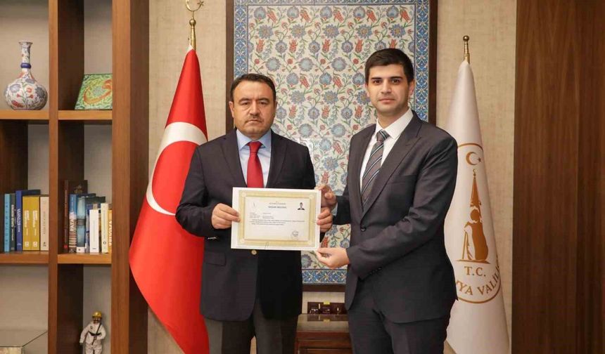 Vali Işın'dan Kaymakam Teltik'e başarı belgesi